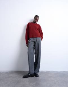 Model wearing Knitted ultimate mid jumper in red