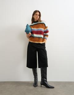 Model wearing Knitted ultra fluffy multi stripe jumper