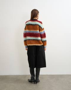 Model wearing Knitted ultra fluffy multi stripe jumper