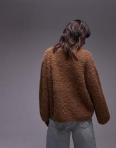 Model wearing Knitted ultra fluffy oversized jumper in toffee