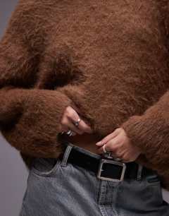 Model wearing Knitted ultra fluffy oversized jumper in toffee