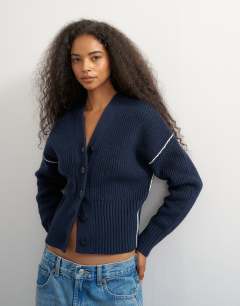 Model wearing Knitted v neck button front cardigan in midnight