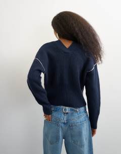 Model wearing Knitted v neck button front cardigan in midnight