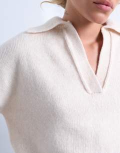 Model wearing Knitted v neck collar jumper in oat