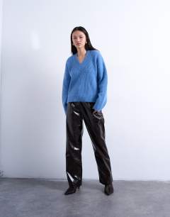 Model wearing Knitted v neck jumper in blue