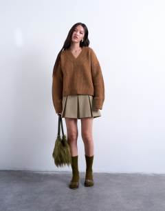 Model wearing Knitted v neck jumper in brown