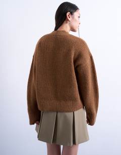 Model wearing Knitted v neck jumper in brown