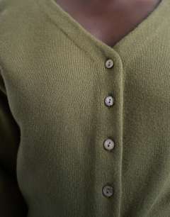 Model wearing Knitted V neck longline compact fitted waist cardigan in green
