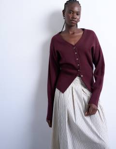 Model wearing Knitted V neck longline compact fitted waist cardigan in plum