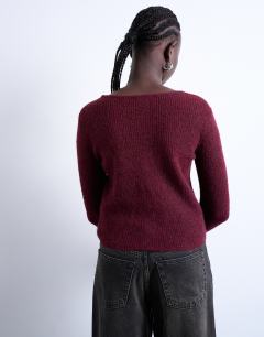 Model wearing Knitted v-neck ribbed cardigan in burgundy