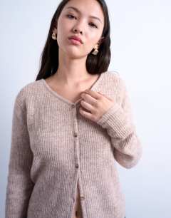 Model wearing Knitted v-neck ribbed cardigan in stone