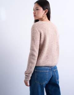 Model wearing Knitted v-neck ribbed cardigan in stone