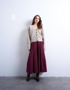 Model wearing Knitted v neck slouchy cardigan in oat