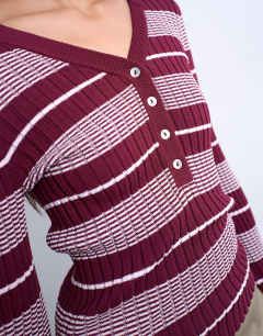 Model wearing Knitted v neck striped long sleeve top in burgundy