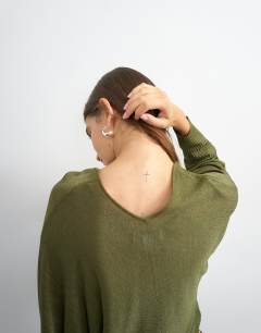 Model wearing Knitted v slouchy fine knit sheer jumper in khaki