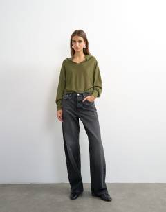 Model wearing Knitted v slouchy fine knit sheer jumper in khaki