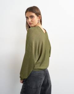 Model wearing Knitted v slouchy fine knit sheer jumper in khaki