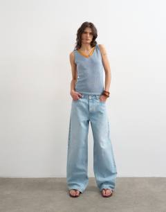 Model wearing Knitted vest in blue with orange contrast lace 