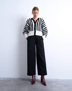 Model wearing Knitted vetical stripe cardigan in mono