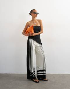 Model wearing Knitted wide leg trouser in black and ecru
