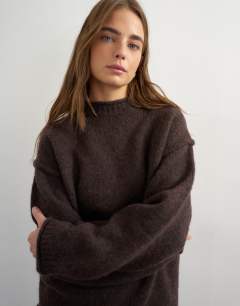 Model wearing Knitted wool blend roll edge chunky jumper in chocolate