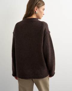 Model wearing Knitted wool blend roll edge chunky jumper in chocolate