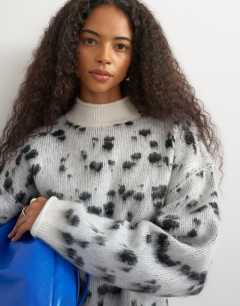 Model wearing Knitted wool blend roll edge chunky jumper in dalmatian