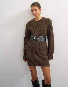 Model wearing Knitted wool blend slouchy ribbed mini dress with shoulder padding in chocolate brown