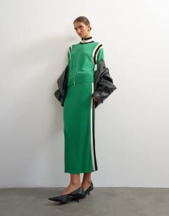 Model wearing Knitted wool blend zip through funnel neck contrast panel co-ord jacket in green