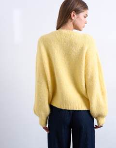 Model wearing Knitted wool brushed fluffy v neck cardigan in yellow