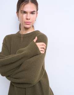 Model wearing Knitted wool crew neck mini dress in khaki