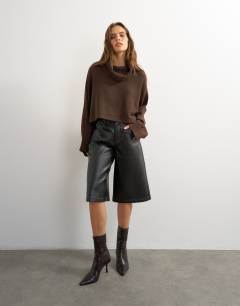 Model wearing Knitted wool short cape jumper in chocolate