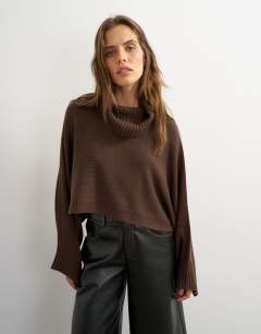 Model wearing Knitted wool short cape jumper in chocolate