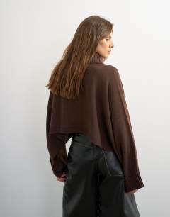 Model wearing Knitted wool short cape jumper in chocolate