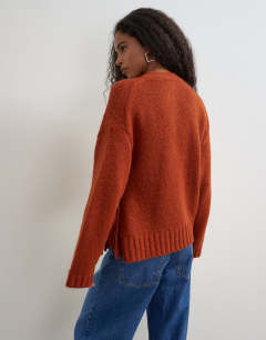 Model wearing Knitted wrap boxy cardigan with wool in cinnamon