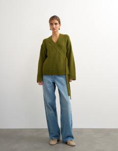 Model wearing Knitted wrap boxy cardigan with wool in moss