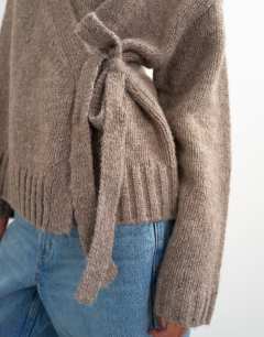 Model wearing Knitted wrap boxy cardigan with wool in oat
