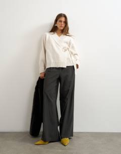 Model wearing Knitted wrap tie waist cardigan with wool in ivory