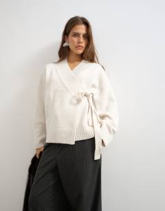 Model wearing Knitted wrap tie waist cardigan with wool in ivory