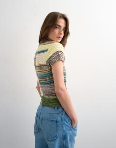 Model wearing Knitted zip through stripe polo in yellow
