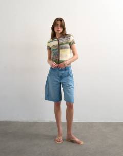 Model wearing Knitted zip through stripe polo in yellow