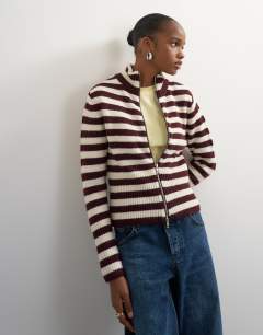 Model wearing Knitted zip up cardigan in burgundy and ecru stripe