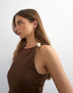 Model wearing Knot detail beaded ruched tank in chocolate