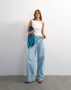 Model wearing Knot detail beaded ruched tank in ivory