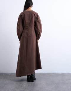 Model wearing Knot detail midi dress with asymmetric hem in brown