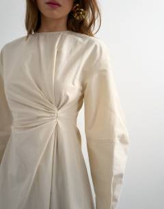 Model wearing Knot detail midi dress with asymmetric hem in off white