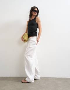 Model wearing Knot detail ruched side tank in black