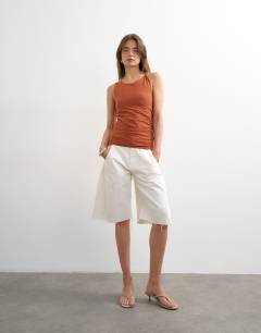 Model wearing Knot detail ruched side tank in brown