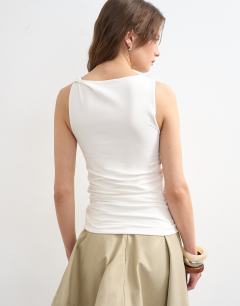 Model wearing Knot detail ruched side tank in ivory