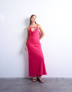 Model wearing Knot neck deep cowl occasion midi in fushcia pink